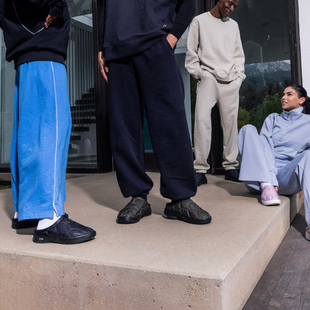 Models sitting and standing outside wearing oocoozie thermo mule black, alpine moss, and stardust